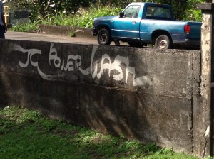 The Church Wall & the 'JC Power Wash' ad